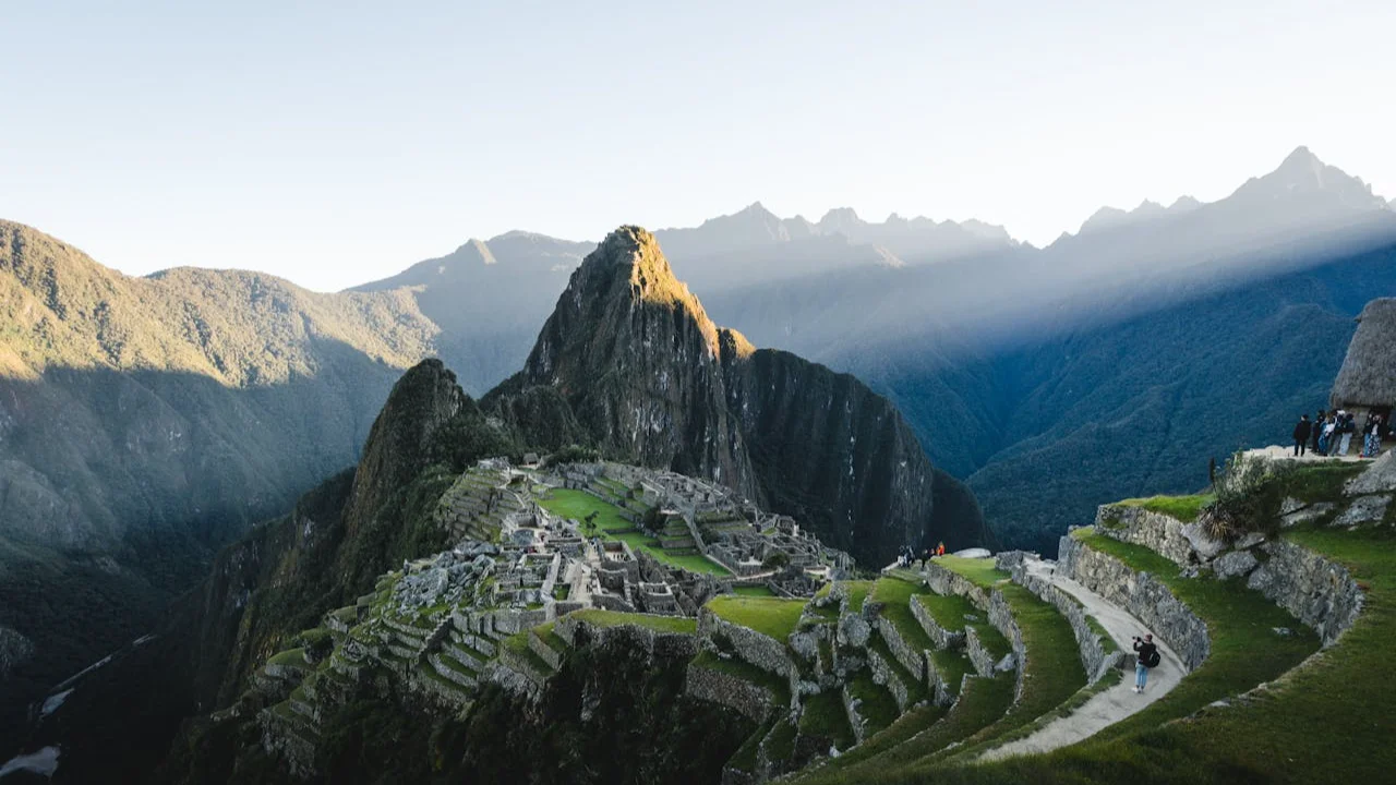 Hikers on the Inca Trail with mountain views toward Machu Picchu (inca trail vs sacred valley) | Cusco Tours